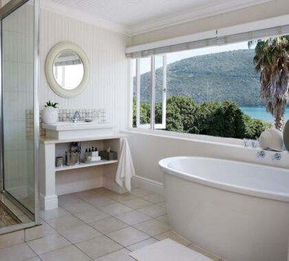 The ample sized bathrooms have their own private views of the Knysna Lagoon - total bliss!