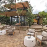 Get a drink at the bar and pick a spot on the viewing deck to relax and watch the river and wildlife. 