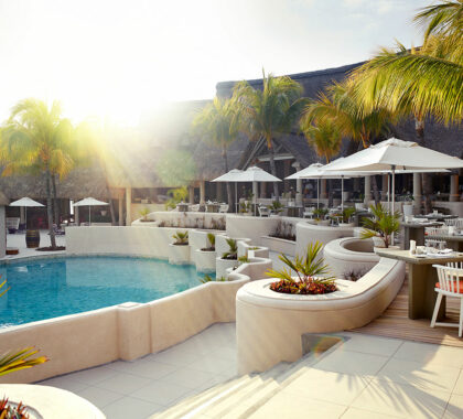 Next on your itinerary is Mauritius. Laze around the swimming pool, cocktail in hand and enjoy the summer sunshine. 