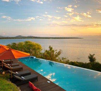 Enjoy a classic African sunset from the comfort of Pumulani's pool deck.