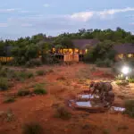 The main lodge overlooks a waterhole.