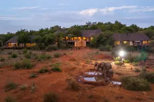 The main lodge overlooks a waterhole.