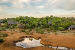 The main lodge overlooks a waterhole.