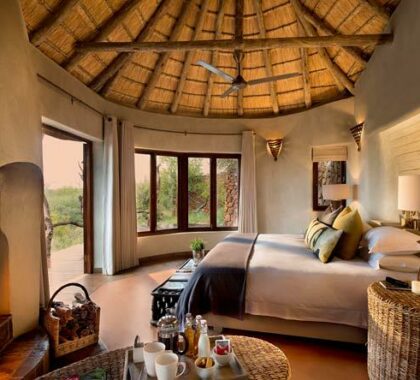 The luxurious African-style suites are thatched, with original fireplaces and plenty of personal touches.