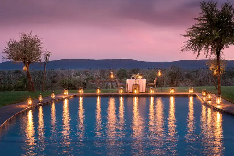 Dine under the stars next to a sparkling swimming pool.
