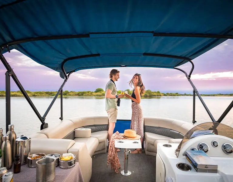 Witness iconic African sunsets on a boat cruise. 