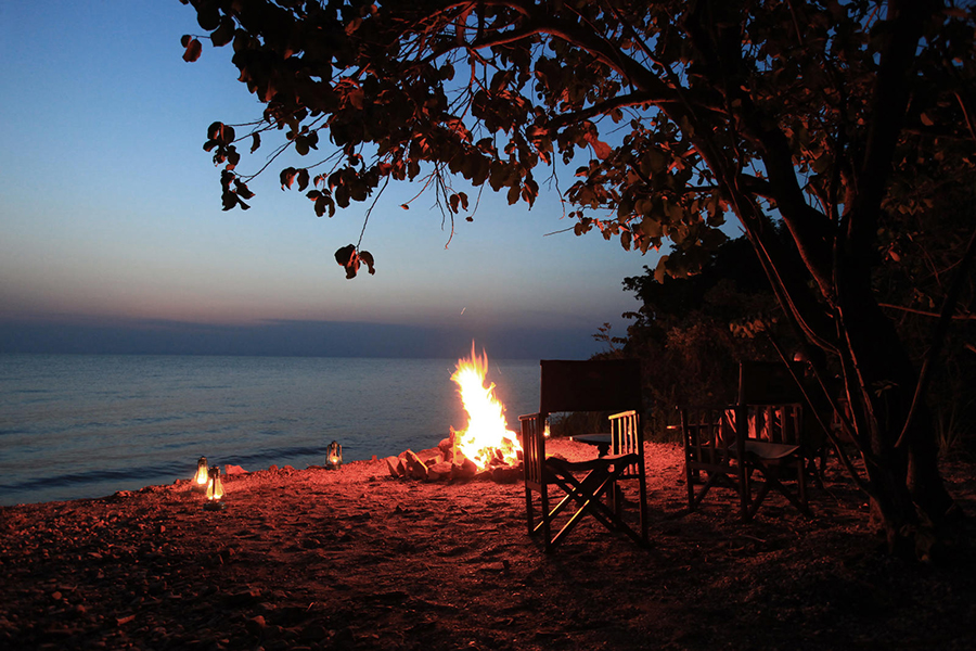 Evening bonfire at Gombe Lodge