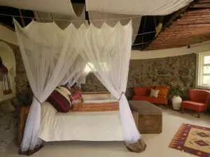 Draped mosquito nets assure a good night's sleep at Mbweha Safari Camp.