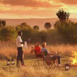 End the day the safari way: a camp-fire, a sunset view & your favourite chilled drink.