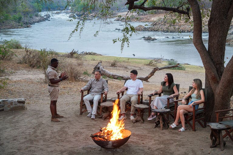 Drinks and story sharing around the camp fire.
