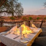 Lantern-lit dinners overlooking the river vista. 
