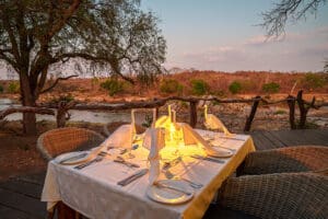Lantern-lit dinners overlooking the river vista. 