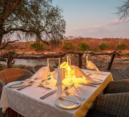 Lantern-lit dinners overlooking the river vista. 