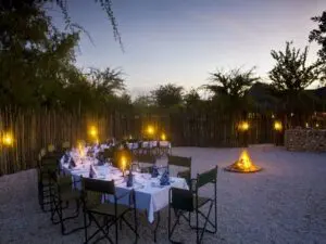 Dining around a camp fire lit where guest can exchange stories of the day’s wildlife sightings