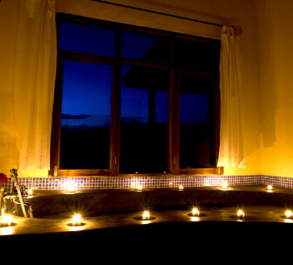 Watch as the candles around the room flicker as you have a soothing soak in the large bathtub.