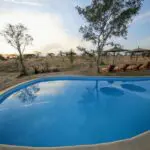 A large swimming pool provides the opportunity to cool off and bask in the dazzling African sun.
