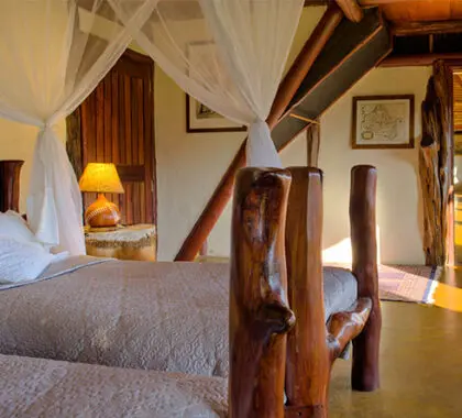 Complete with mosquito nets, the second bedroom's twin beds make it perfect for children.