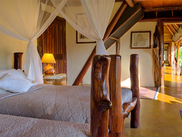 Complete with mosquito nets, the second bedroom's twin beds make it perfect for children.