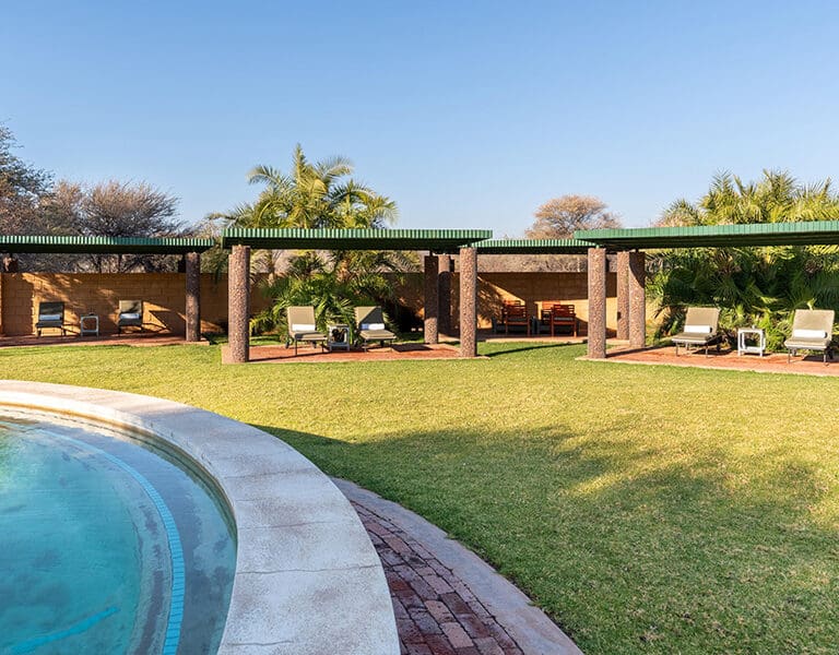 Relax on the pool loungers. 
