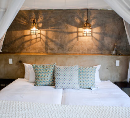 The beds are draped in mosquito nets and are stylishly decorated with fine linens, throws and pillows.