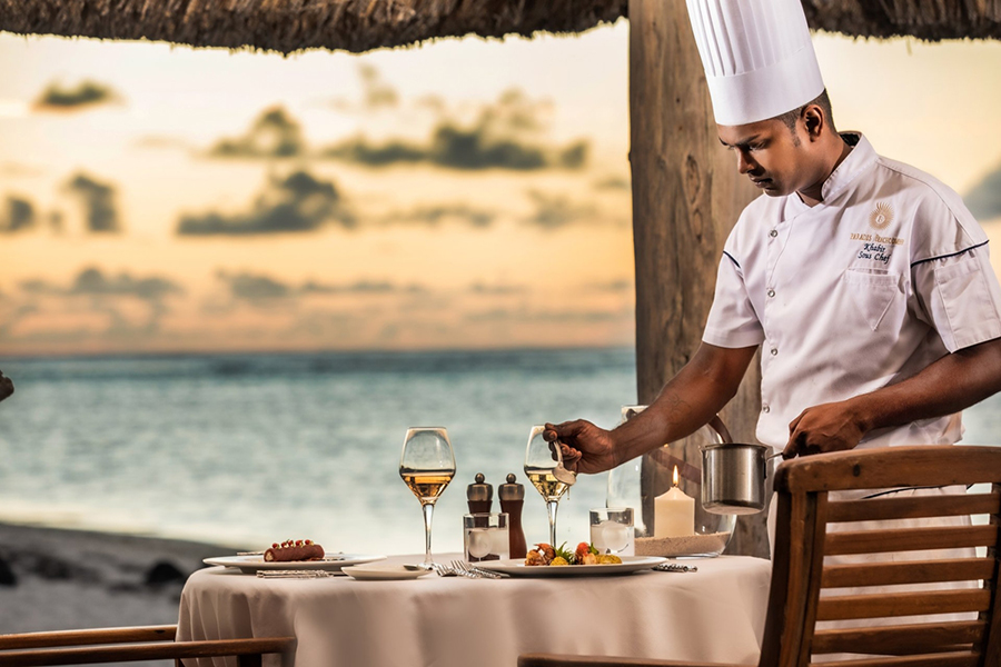 Setting up a sunset dinner for two at Paradis Beachcomber Golf Resort & Spa | Go2Africa