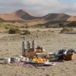 Enjoy a romantic picnic outdoors surrounded by the stark beauty of the Namibian desert.