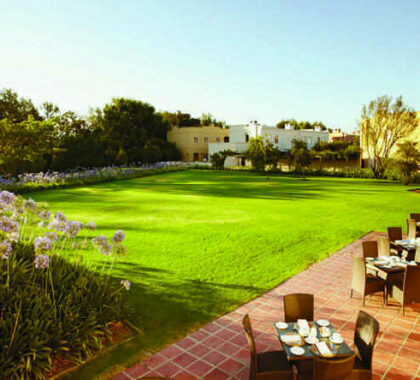 Enjoy the beautifully manicured gardens around the hotel while having breakfast on the patio