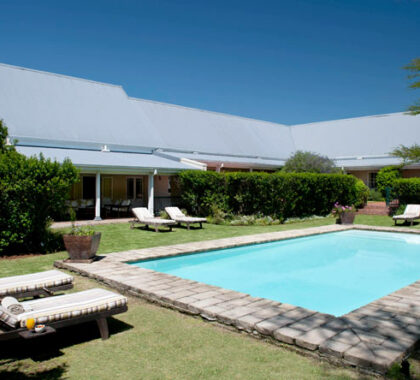 The spacious garden and pool area offers a wonderful place to relax and soak up the South African sun.
