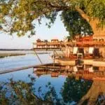 The scenic swimming pool and bar deck almost overhangs the river, providing spectacular sunset views.
