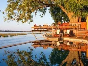 The scenic swimming pool and bar deck almost overhangs the river, providing spectacular sunset views.
