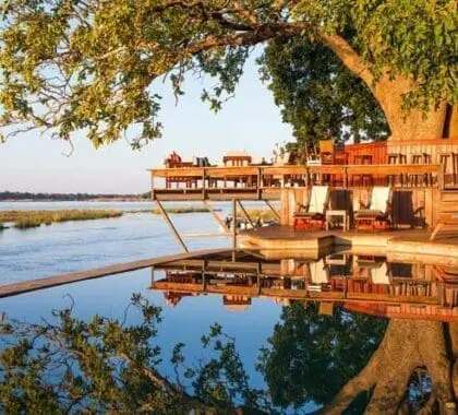 The scenic swimming pool and bar deck almost overhangs the river, providing spectacular sunset views.
