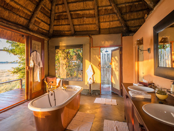 Each en-suite bathroom has a classic copper bathtub and romantic outdoor shower.
