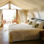 The beautiful romantic suites are light and airy, with a private deck and views of the river.
