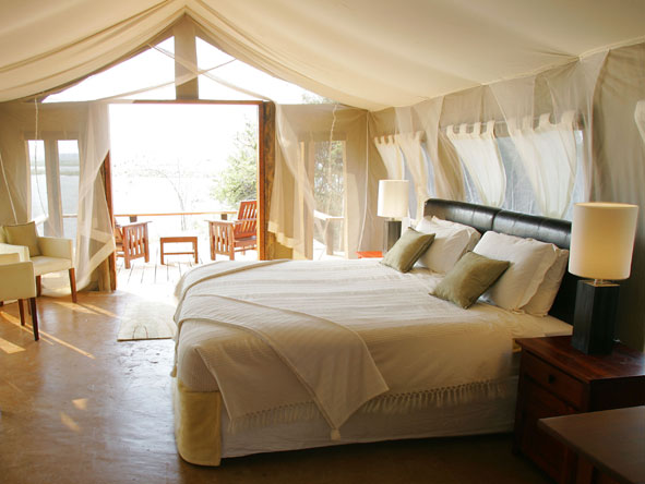 The beautiful romantic suites are light and airy, with a private deck and views of the river.

