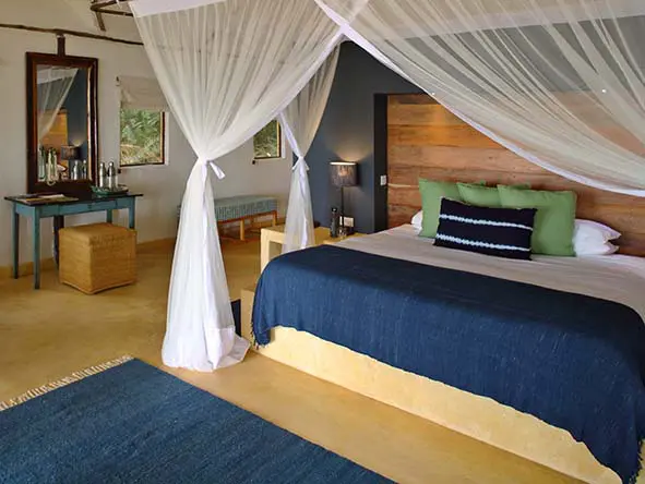 With tented ceilings, a thatched roof, and a “safari-chic” décor, the chalets are at once cozy and lofty. 