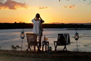 Watch the sun set beyond the river.