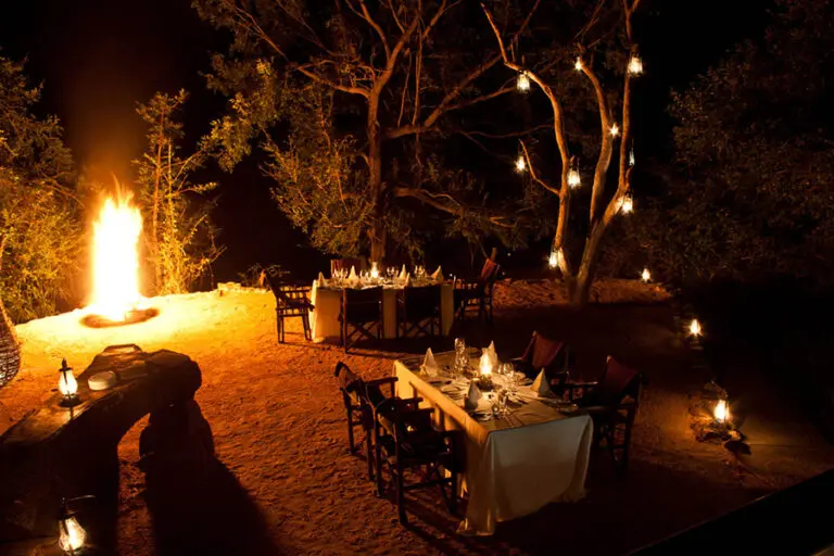 A traditional open-air boma and under the trees.