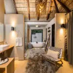 The en suite bathroom boasts twin vanities.