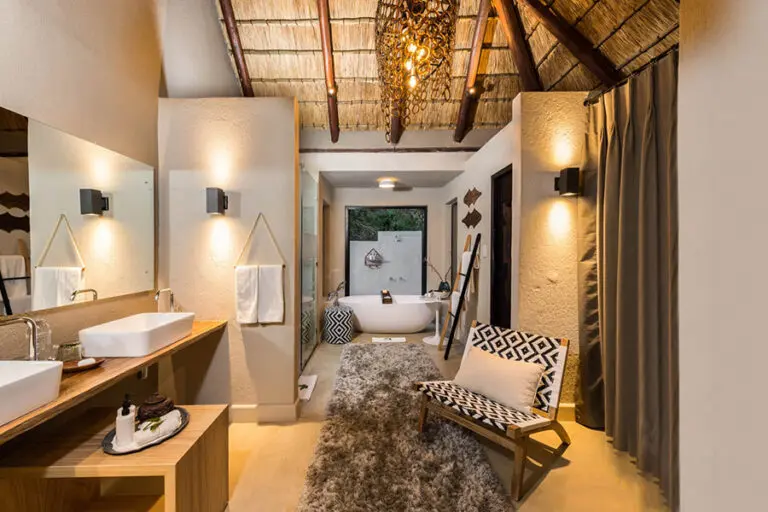 The en suite bathroom boasts twin vanities.
