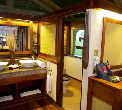 Each of the canvas & thatched chalets has an en suite bathroom with all the creature comforts.