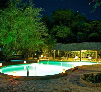 Spot-lit at night, the camp's swimming pool makes for cool relief at any time of day.
