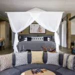 Bedroom with lounge suite.