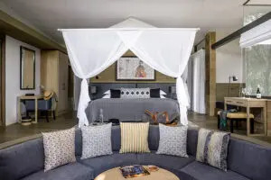 Bedroom with lounge suite.