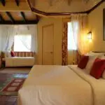 The bedroom offers a lot of space and a cozy atmosphere.