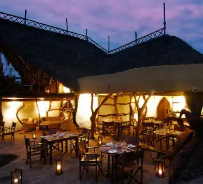In the evening, the camp is lit up to provide a soft light over the outdoor dining area.