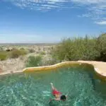 Return to camp after a morning's game drive and enjoy a refreshing swim in the rim-flow pool.