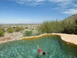 Return to camp after a morning's game drive and enjoy a refreshing swim in the rim-flow pool.
