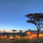 Exterior at night of the Serengeti Under Canvas camp.