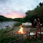 Take your drink down to the river as dusk settles & reflect on the day's game sightings.