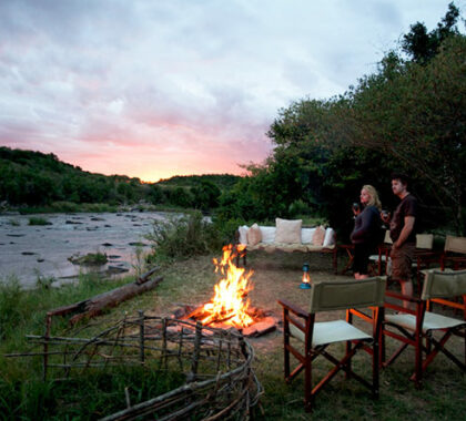 Take your drink down to the river as dusk settles & reflect on the day's game sightings.